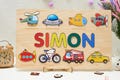 Custom Transportation Name Puzzle for Kids, Montessori Baby Gift with Cars, Trucks, Trains, and Planes, Ideal for Birthdays or Baby Showers