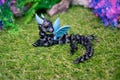 Little articulated dragon with glass eyes  and wings. Flexible Dragon. 3D Printed Dragon.  + Christmas hat