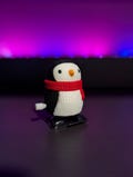 3D Printed Wind-Up Penguin Toy with Red Scarf